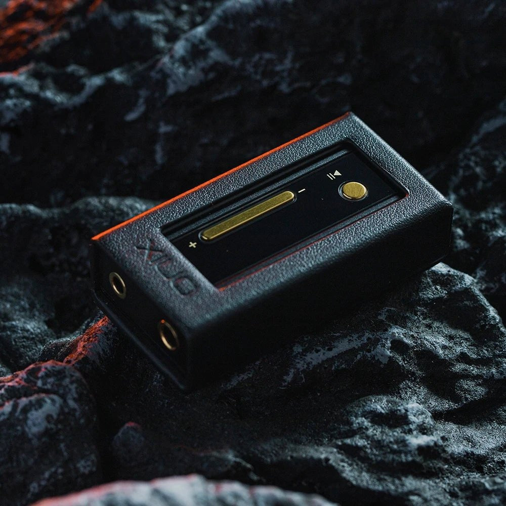 ONIX Alpha XI1 fitted inside its leather case resting on dark stone